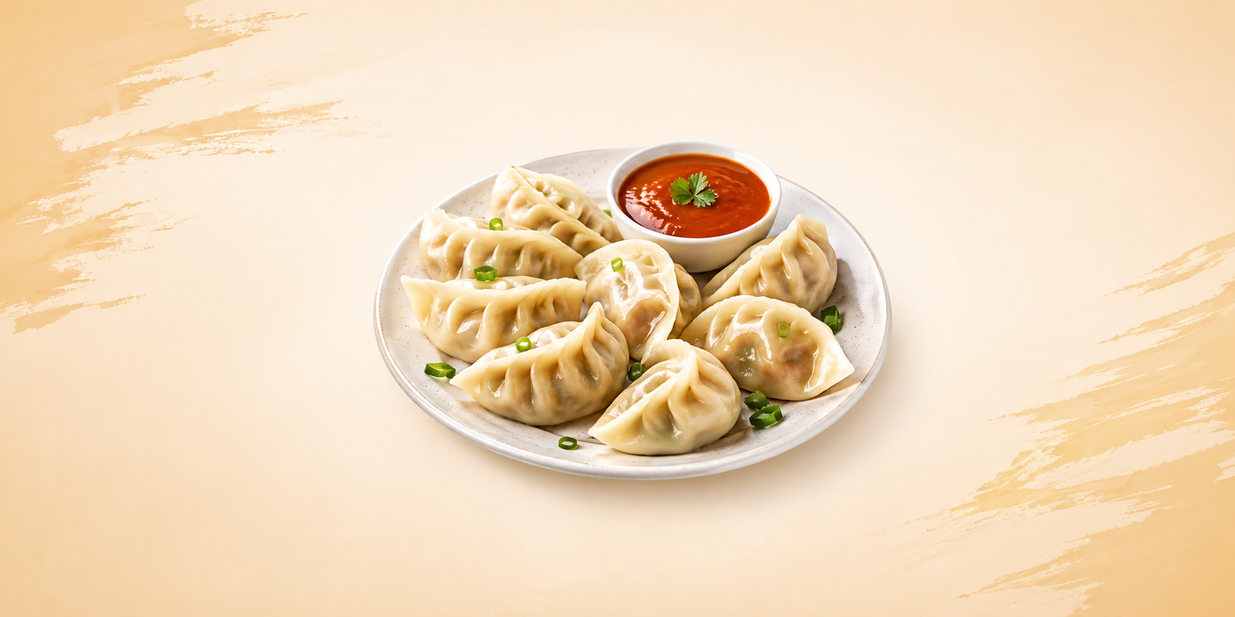 A plate of assorted fresh momo dumplings served with dipping sauce